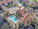 Community pool, tennis courts, and clubhouse with lake view at 2400 Feather Sound Dr # 418, Clearwater, FL 33762