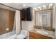 Bathroom with granite vanity and tile shower/tub at 2400 Feather Sound Dr # 418, Clearwater, FL 33762