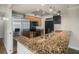 Kitchen with granite countertops and stainless steel appliances at 2400 Feather Sound Dr # 418, Clearwater, FL 33762