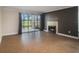 Living room with fireplace and view of patio at 2400 Feather Sound Dr # 418, Clearwater, FL 33762
