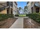 Walkway leading to condo with view of golf course at 2400 Feather Sound Dr # 418, Clearwater, FL 33762