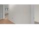 Hallway featuring carpet and wood flooring leading to the bedrooms and living areas at 2679 Sabal Springs Cir # 203, Clearwater, FL 33761