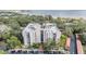 Aerial view of a condo building by the water at 2699 Seville Blvd # 403, Clearwater, FL 33764