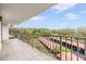 Balcony overlooking trees and parking at 2699 Seville Blvd # 403, Clearwater, FL 33764