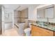 Bathroom with granite vanity and glass sink at 2699 Seville Blvd # 403, Clearwater, FL 33764