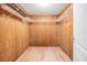 Large walk-in closet with wood shelving at 2699 Seville Blvd # 403, Clearwater, FL 33764