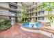 Courtyard with fountain and landscaping at 2699 Seville Blvd # 403, Clearwater, FL 33764