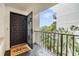 Welcoming entryway with a balcony offering a view of the courtyard at 2699 Seville Blvd # 403, Clearwater, FL 33764