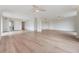 Spacious living room with hardwood floors and ceiling fans at 2699 Seville Blvd # 403, Clearwater, FL 33764