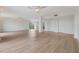 Hardwood floor living room with access to the kitchen at 2699 Seville Blvd # 403, Clearwater, FL 33764