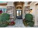 Inviting entryway with double doors and stone accents at 31072 Chesapeake Bay Dr, Wesley Chapel, FL 33543