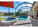 Enclosed pool and spa with patio and lake view at 31072 Chesapeake Bay Dr, Wesley Chapel, FL 33543