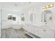 Elegant bathroom featuring a soaking tub and double vanity at 380 Colony Point S Rd, St Petersburg, FL 33705