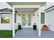 Modern front entrance with double glass doors and stylish planters at 380 Colony Point S Rd, St Petersburg, FL 33705