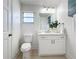 Modern bathroom with updated vanity, toilet, and light flooring at 3932 Ashwood Ln # 42, Sarasota, FL 34232