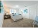 Bright bedroom with carpeted floors and a window at 3932 Ashwood Ln # 42, Sarasota, FL 34232