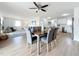Bright dining area with wood table and gray chairs at 3932 Ashwood Ln # 42, Sarasota, FL 34232