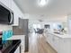 Open concept kitchen with stainless steel appliances and island at 3932 Ashwood Ln # 42, Sarasota, FL 34232