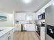 Modern kitchen featuring white cabinets and stainless steel appliances at 3932 Ashwood Ln # 42, Sarasota, FL 34232