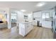 Open kitchen with island and views into adjacent living and bedroom areas at 3932 Ashwood Ln # 42, Sarasota, FL 34232