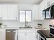 Newly renovated kitchen with white cabinets and updated fixtures at 3932 Ashwood Ln # 42, Sarasota, FL 34232