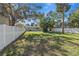 Fenced backyard with mature trees providing shade at 4951 86Th N Ave, Pinellas Park, FL 33782