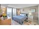 Spacious bedroom with a king-size bed and balcony access at 5915 Sea Ranch Dr # 603, Hudson, FL 34667