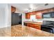 Modern kitchen with granite countertops and stainless steel appliances at 6948 Trout St, Tampa, FL 33617