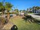 Residential street view showing lush landscaping and neighborhood homes at 7906 9Th S Ave, St Petersburg, FL 33707