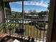 Enjoy a relaxing view of the pool and surrounding landscape from this balcony at 8765 Bardmoor Blvd # 308, Seminole, FL 33777