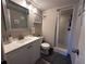 Clean bathroom with a shower/tub combo, updated vanity, and mirror at 8765 Bardmoor Blvd # 308, Seminole, FL 33777