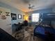 Spacious bedroom with a bunk bed, desk, and ceiling fan at 8765 Bardmoor Blvd # 308, Seminole, FL 33777