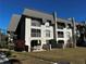 Two-story building with patio and grassy yard at 8765 Bardmoor Blvd # 308, Seminole, FL 33777