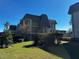 Three-story building with a gray roof and landscaping at 8765 Bardmoor Blvd # 308, Seminole, FL 33777