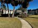 Paved pathway winds through Cordova Greens community landscaping at 8765 Bardmoor Blvd # 308, Seminole, FL 33777