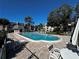 Relaxing community pool with lounge chairs at 8765 Bardmoor Blvd # 308, Seminole, FL 33777