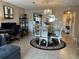 Charming dining area with a round table, chairs, and chandelier at 8765 Bardmoor Blvd # 308, Seminole, FL 33777