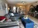 Spacious living room with sectional sofa and view to dining area at 8765 Bardmoor Blvd # 308, Seminole, FL 33777