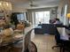 Bright living room with sectional sofa and dining area at 8765 Bardmoor Blvd # 308, Seminole, FL 33777