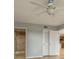 Bright bedroom with ceiling fan, neutral walls, and wood-look flooring at 9433 Harbor Greens Way # 501, Seminole, FL 33776