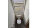Small half bathroom with toilet and gray tile floor at 12954 Fennway Ridge Dr, Riverview, FL 33579