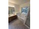 Bathroom with double vanity, tub, and shower at 12954 Fennway Ridge Dr, Riverview, FL 33579
