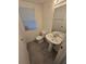 Clean bathroom with pedestal sink and toilet at 12954 Fennway Ridge Dr, Riverview, FL 33579