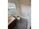 Bathroom with tub, toilet and wood vanity at 12954 Fennway Ridge Dr, Riverview, FL 33579