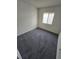 Simple bedroom with grey carpet and window at 12954 Fennway Ridge Dr, Riverview, FL 33579