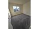 Well-lit bedroom with grey carpet and large window at 12954 Fennway Ridge Dr, Riverview, FL 33579