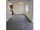 Bright dining room with grey carpet and chandelier at 12954 Fennway Ridge Dr, Riverview, FL 33579