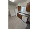 Kitchen with wood cabinets, granite counters, and appliances at 12954 Fennway Ridge Dr, Riverview, FL 33579