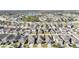 Wide aerial view of neighborhood with houses and streets at 14441 Scottburgh Glen Dr, Wimauma, FL 33598