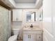 Clean bathroom with updated vanity and shower at 1611 Brook Dr, Dunedin, FL 34698